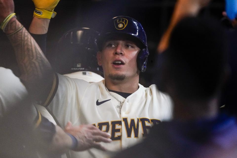 Milwaukee Brewers' Luis Urias is congratulated after hitting a home run during the third inning of a baseball game against the Arizona Diamondbacks Tuesday, Oct. 4, 2022, in Milwaukee. (AP Photo/Morry Gash)