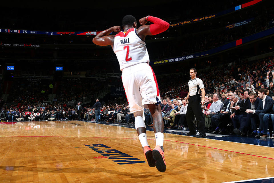 John Wall flexed his muscles when the Wizards needed him most to knock off the Bulls. (Ned Dishman/NBAE/Getty Images)