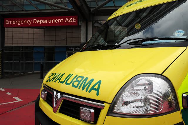 An ambulance outside an entrance to a hospital accident and emergency department