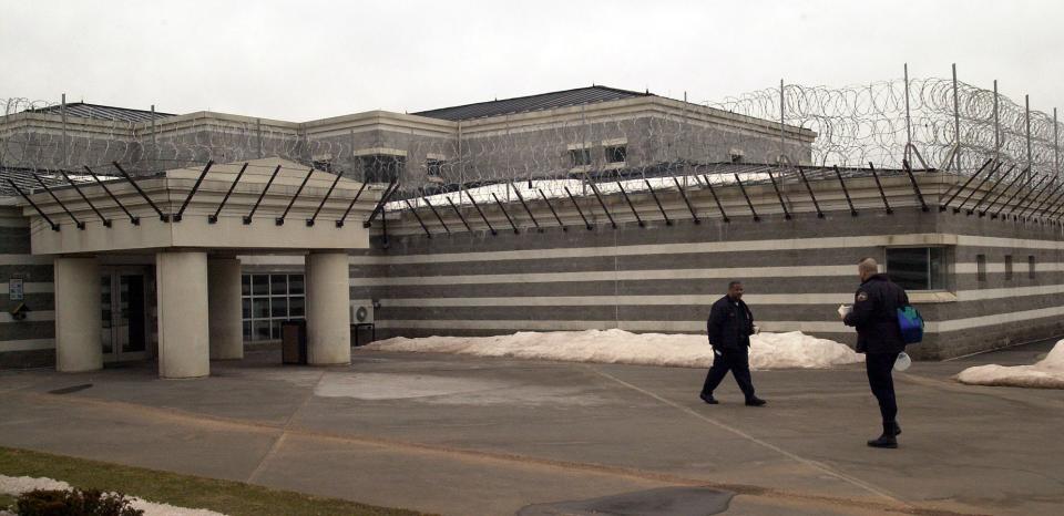 Guards change shifts at the entrance to the Northern Correctional Institution in Somers, Connecticut, in February 2001.