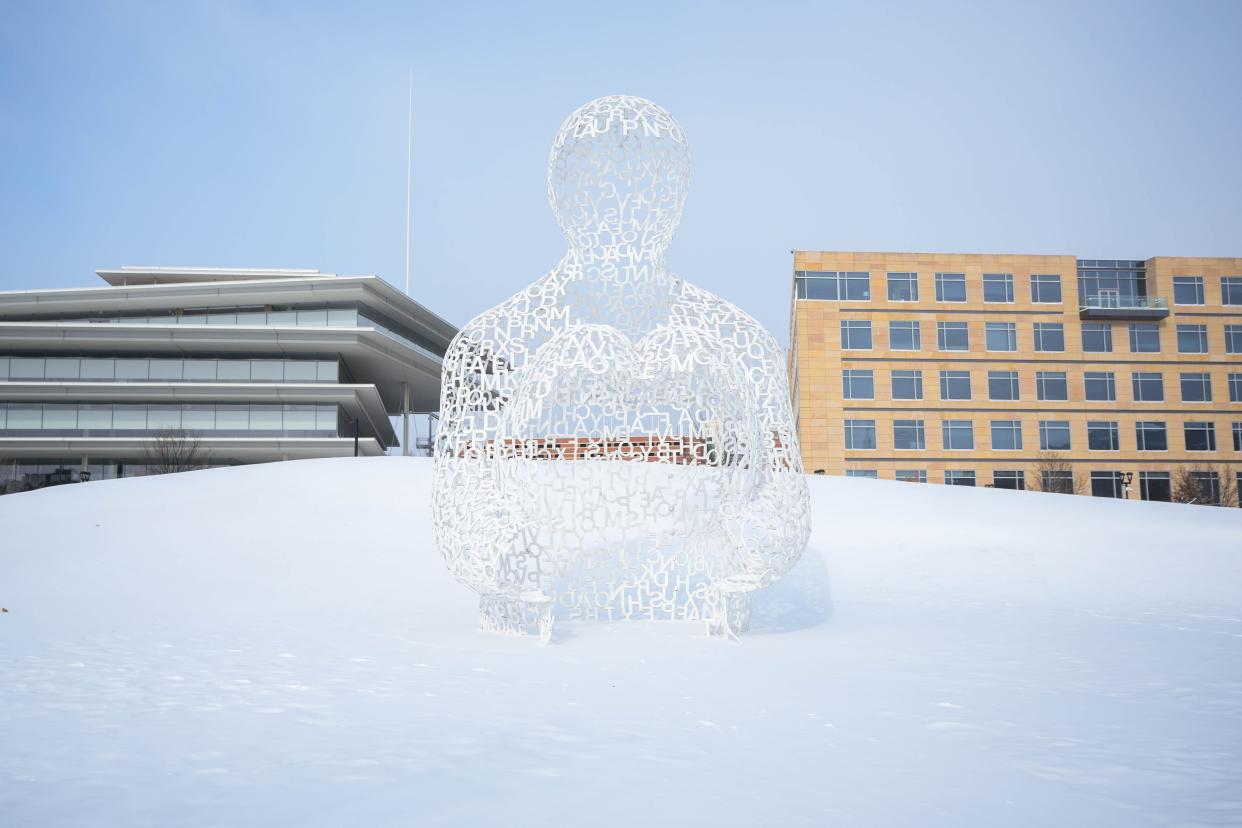 Spanish artist Jaume Plensa's "Nomade" sculpture collects a snow drift around it at the Pappajohn Sculpture Park in Des Moines on Thursday, Dec. 22, 2022.