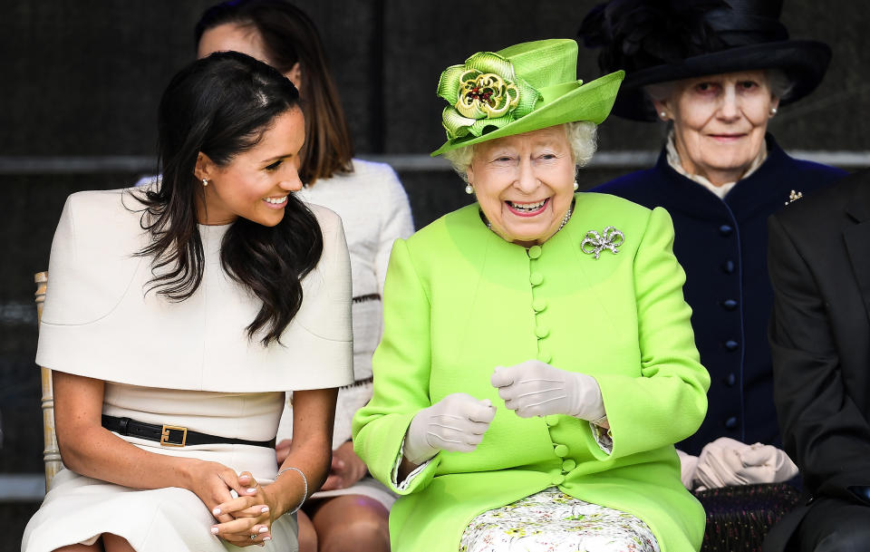 Queen Elizabeth II with Meghan Markle during a ceremony. (Jeff J Mitchell / Getty Images)