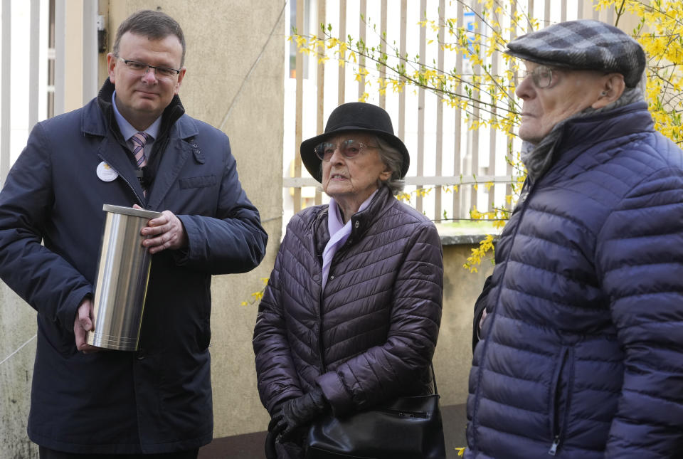 Albert Stankowski, left, the director of the Warsaw Ghetto Museum, Anna Stupnicka-Bando, center, a Polish Christian honored for saving Jews, and Waclaw Kornblum, right, a Polish Holocaust survivor, attend a ceremony for the burial of a "time capsule" on the grounds of the museum in Warsaw, Poland, on Tuesday April 18, 2023. The time capsule contains memorabilia and a message to future generations. It was buried on the grounds of a former children's hospital, a building that will house Warsaw Ghetto Museum, which is scheduled to open in three years. Tuesday's ceremony comes on the eve of the 80th anniversary of the Warsaw Ghetto Uprising, the largest single Jewish revolt against German forces during the Holocaust. (AP Photo/Czarek Sokolowski)