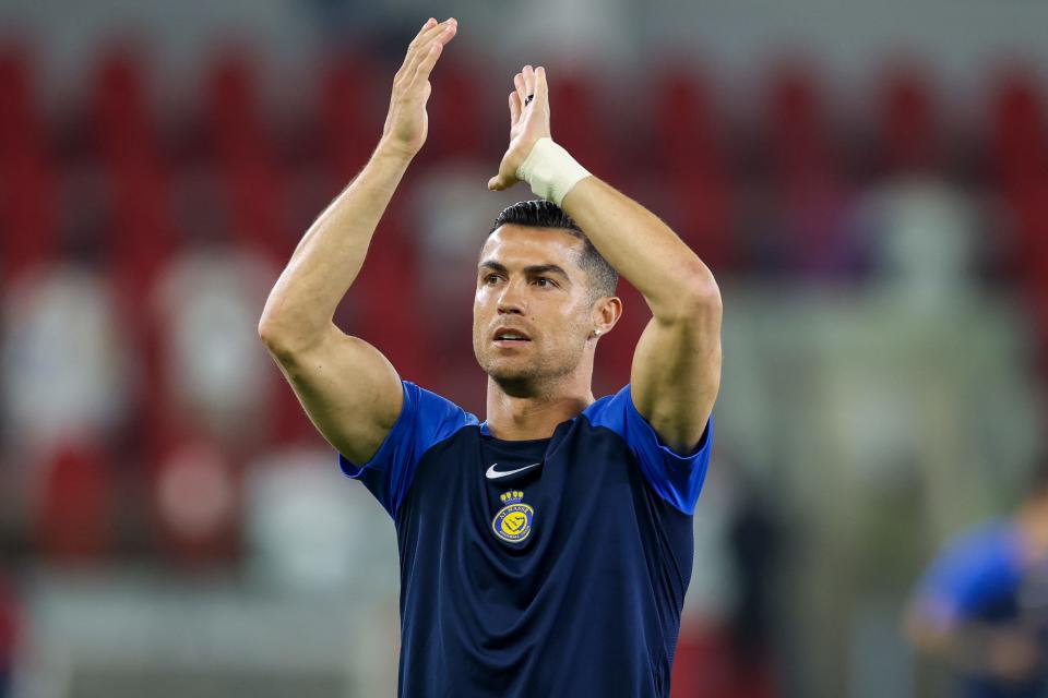 Nassr's Portuguese forward Cristiano Ronaldo greets the fans ahead of the Saudi Pro League football match between Al-Ittihad and Al-Nassr at King Abdullah Sports City Stadium in Jeddah on Dec. 26, 2023.