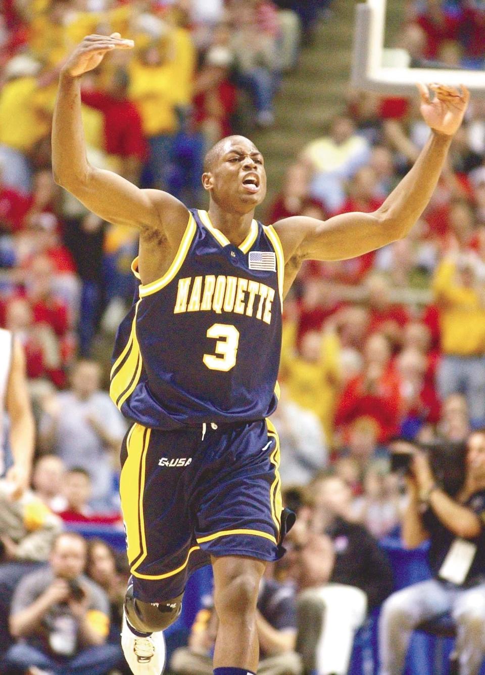 Dwyane Wade celebrates after a teammate's three-pointer in the first half of in their game against Pittsburgh at the Metrodome in Minneapolis.