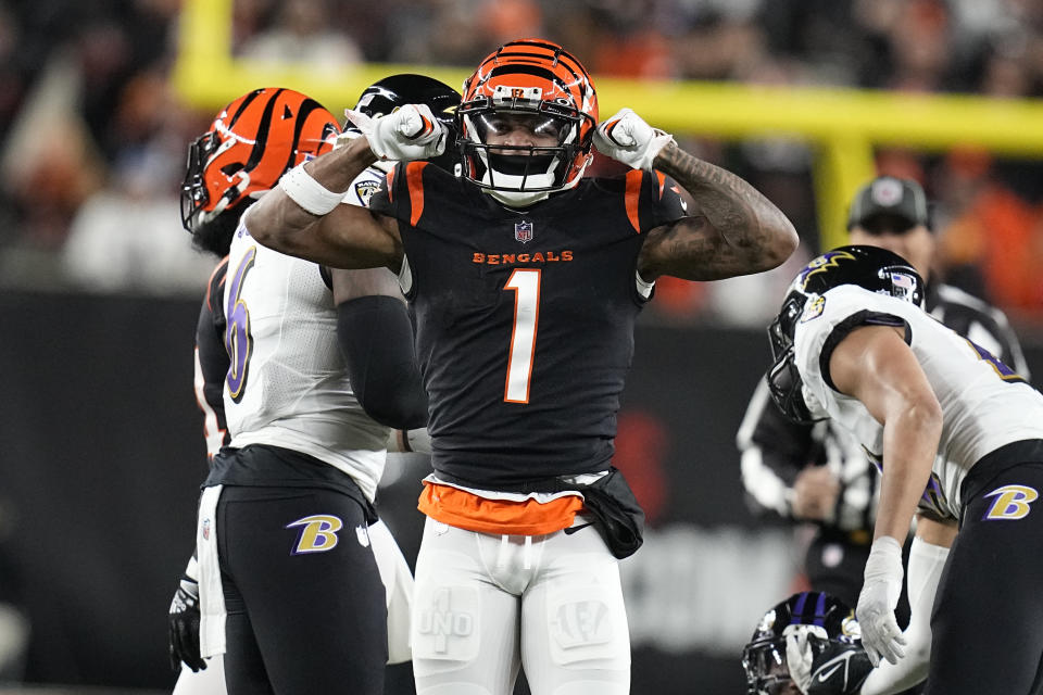 Cincinnati Bengals wide receiver Ja'Marr Chase celebrates a first down in the first half of an NFL wild-card playoff football game against the Baltimore Ravens in Cincinnati, Sunday, Jan. 15, 2023. (AP Photo/Darron Cummings)