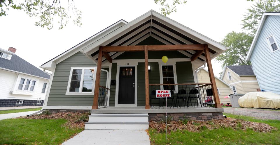 An open house is held Aug. 25, 2022, for a new three-bedroom house built through the Green Bay School District's Bridges Construction and Renovation program in partnership with NeighborWorks Green Bay.