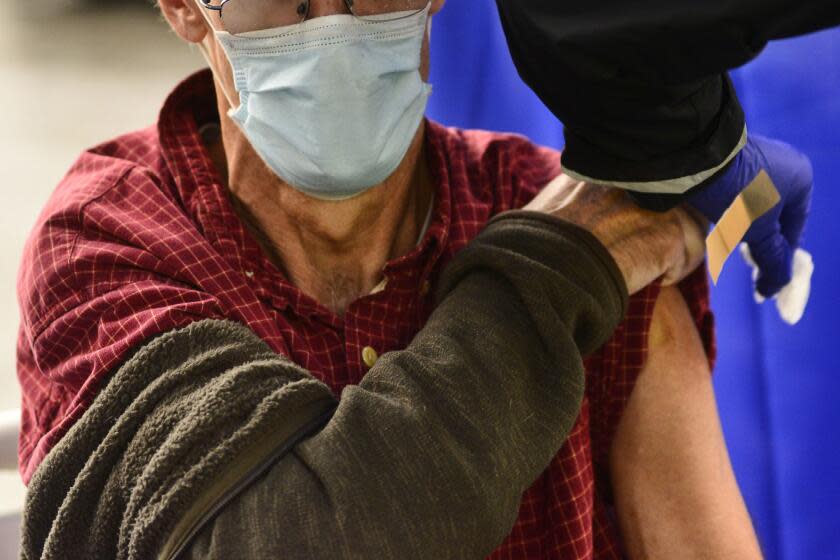 FILE - A man receives a flu shot in Brattleboro, Vt., on Tuesday, Oct. 26, 2021. Doctors have a message for vaccine-weary Americans: Don't skip your flu shot this fall 2022. And for the first time, seniors are urged to get a special extra-strength kind. (Kristopher Radder/The Brattleboro Reformer via AP, File)