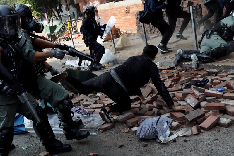 FILE PHOTO: Protesters clash with riot police in the campus of Hong Kong Polytechnic University in Hong Kong