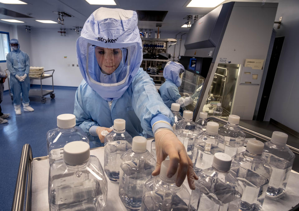 FILE - In this March 27, 2021 file photo a laboratory worker simulates the workflow in a cleanroom of the BioNTech Corona vaccine production in Marburg, Germany, during a media day. Countries in the European Union have ramped up the vaccination after sluggish start. The uptick comes as countries across Europe also grapple with a rise in infections that has pushed the EU’s overall number of confirmed cases close to 30 million. (AP Photo/Michael Probst, file)