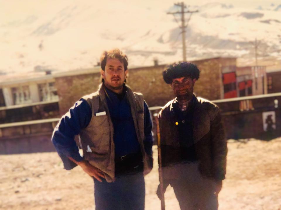 Journalist Josh Meyer, left, reporting from the Pakistan-China border in the 1990s.