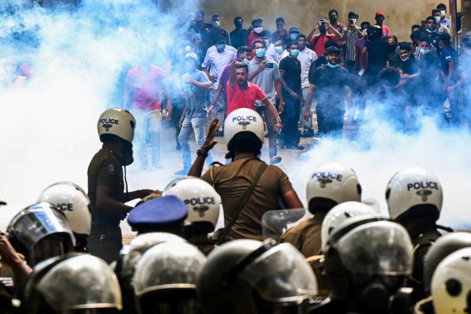 Police use tear gas to disperse Higher National Diploma (HND) students during a demonstration demanding the resignation of Sri Lanka’s President Gotabaya Rajapaksa (AFP via Getty Images)