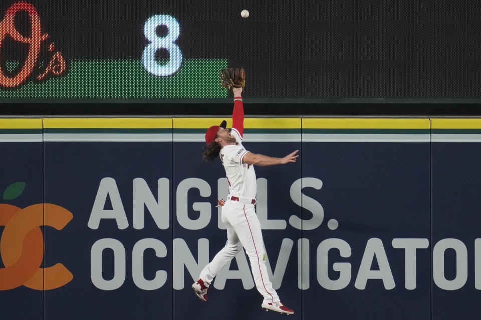 Los Angeles Angels center fielder Brett Phillips (4) catches a fly ball hit by Detroit Tigers' Tyler Nevin during the tenth inning of a baseball game in Anaheim, Calif., Saturday, Sept. 16, 2023. (AP Photo/Ashley Landis)