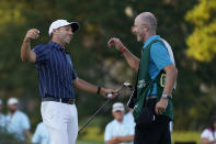 Sergio Garcia, left, of Spain, hugs his caddie after winning the Sanderson Farms Championship golf tournament in Jackson, Miss., Sunday, Oct . 4, 2020. Garcia birdied the final hole for the win. (AP Photo/Rogelio V. Solis)