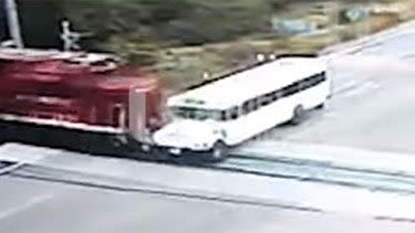 The bus can be seen edging toward the railway, trying to beat the oncoming train. Photo: Supplied