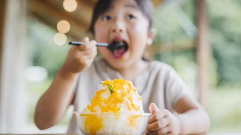 kid eating shaved ice sno-ball