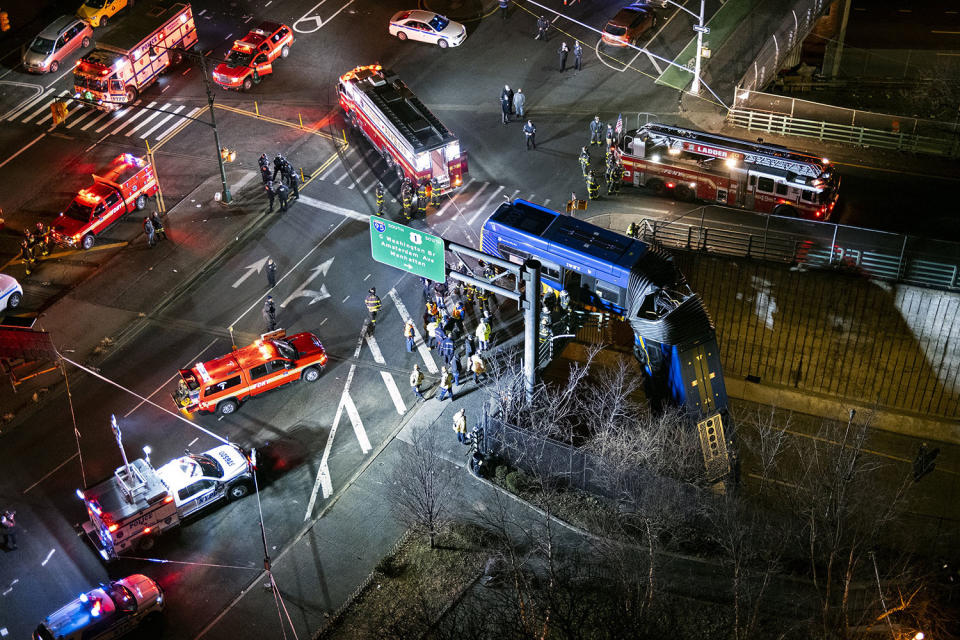 Image: A bus in New York City that careened off a road in the Bronx dangles of an overpass  (Craig Ruttle / AP)