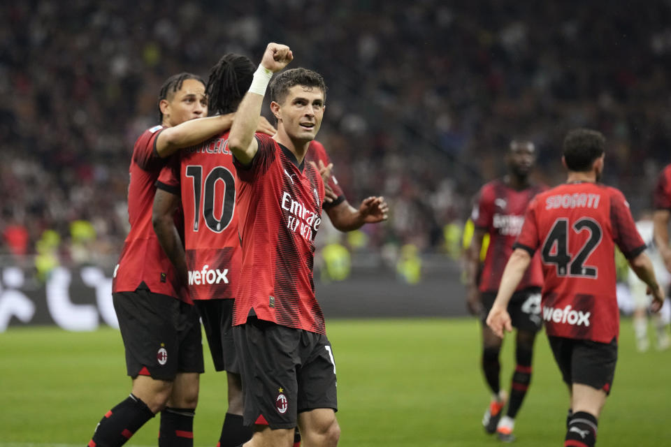AC Milan's Christian Pulisic, centre, celebrates with his teammates after scoring his side's second goal during the Serie A soccer match between AC Milan and Cagliari at the San Siro stadium, in Milan, Italy, Saturday, May 11, 2024. (AP Photo/Antonio Calanni)