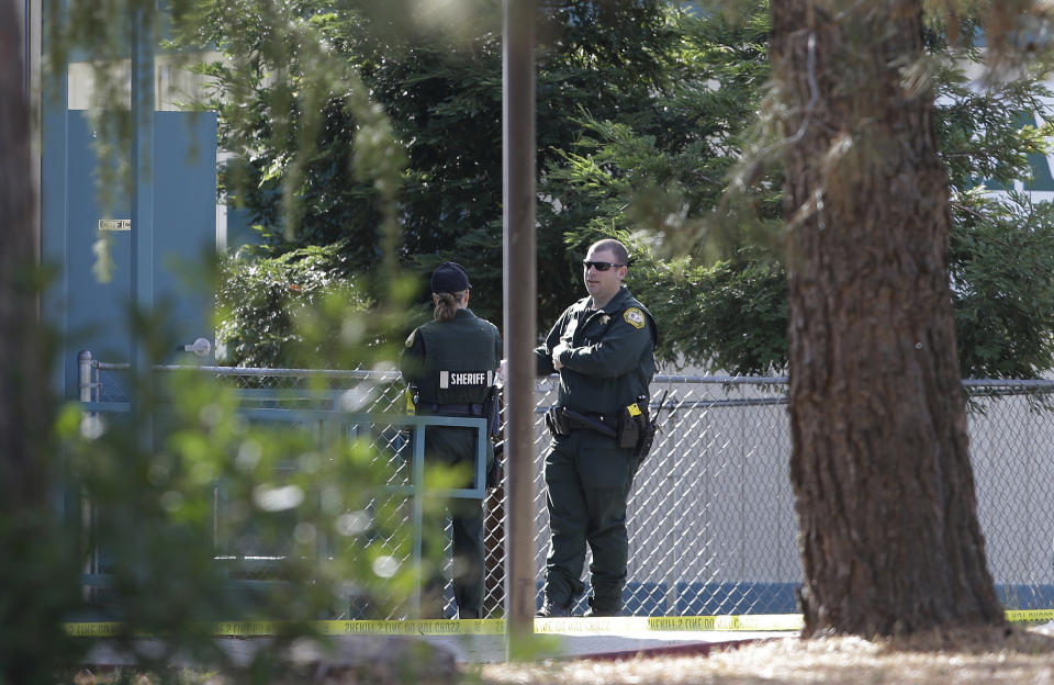 <p>Law enforcement officers are seen at an elementary school in the community of Rancho Tehama Reserve, where a gunman opened fire Tuesday, Nov. 14, 2017, in Corning, Calif. A gunman choosing targets at random opened fire in the rural Northern California town Tuesday, killing several people at several sites and wounding others at the elementary school before police shot him dead, authorities said. (AP Photo/Rich Pedroncelli) </p>