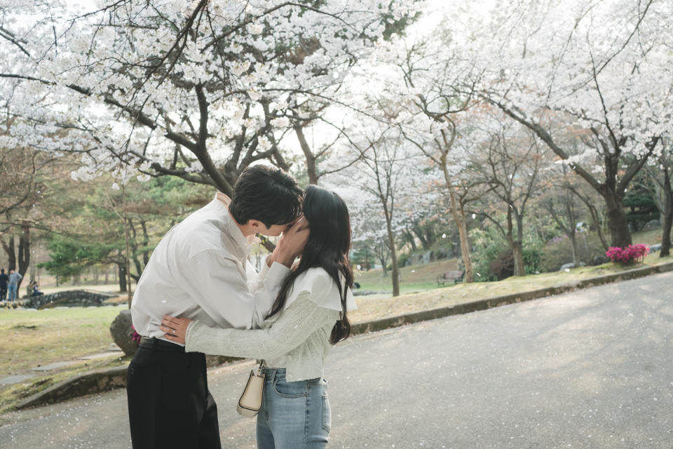 When Sun-jae proposes to Sol and they embrace under the falling cherry blossoms, they see a flash of their future wedding.<span class="copyright">Courtesy of Viki</span>
