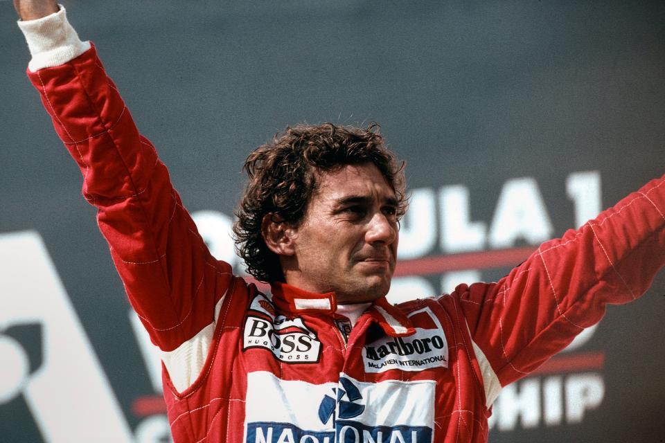 Senna celebrates following his victory at the 1993 Brazilian Grand Prix.