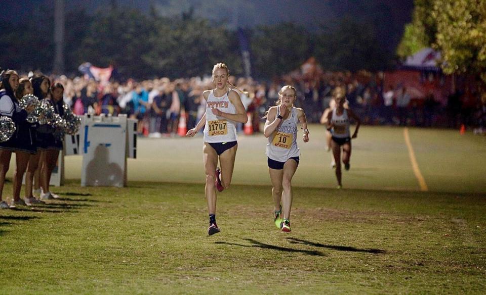 Jane Hedengren (left) of Timpview and Elizabeth Leachman of Champion sprint to the finish Saturday at the Woodbridge Classic.