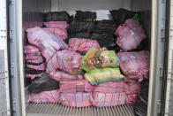 In this photo supplied by the New Zealand police, a shipment of cocaine found floating on the surface of the Pacific Ocean sits stacked in a container in Auckland, New Zealand, Tuesday, Feb. 7, 2023. New Zealand police said Wednesday they found more than 3 tons of cocaine floating in a remote part of the Pacific Ocean after it was dropped there by an international drug-smuggling syndicate. (NZ Police via AP)