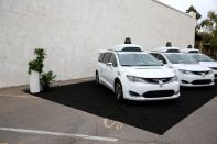 FILE PHOTO: Three Chrysler Pacifica Hybrid self-driving vehicles are displayed during a demonstration in Chandler, Arizona