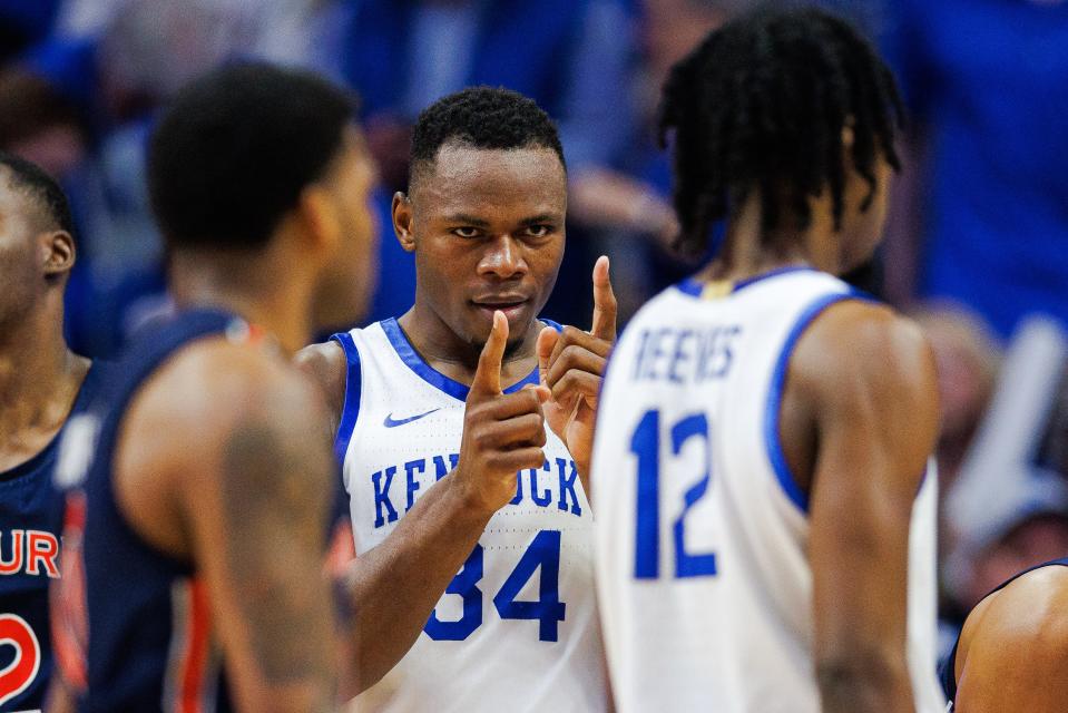 Feb 25, 2023; Lexington, Kentucky, USA; Kentucky Wildcats forward Oscar Tshiebwe (34) celebrates with  guard Antonio Reeves (12) during the second half against the Auburn Tigers at Rupp Arena at Central Bank Center.