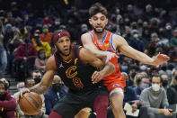 Cleveland Cavaliers' Lamar Stevens (8) drives against Oklahoma City Thunder's Ty Jerome (16) in the first half of an NBA basketball game, Saturday, Jan. 22, 2022, in Cleveland. (AP Photo/Tony Dejak)