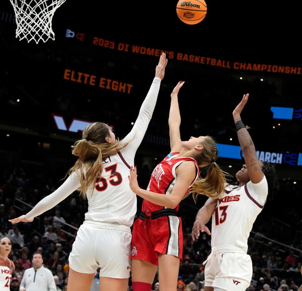 March 27, 2023; Seattle, WA, USA; Ohio State Buckeyes guard Jacy Sheldon (4) is guarded by Virginia Tech Hokies center Elizabeth Kitley (33) and Virginia Tech Hokies forward Taylor Soule (13) during the second half of an NCAA Tournament Elite Eight basketball game at Climate Pledge Arena in Seattle on Monday. Mandatory Credit: Barbara J. Perenic/Columbus Dispatch