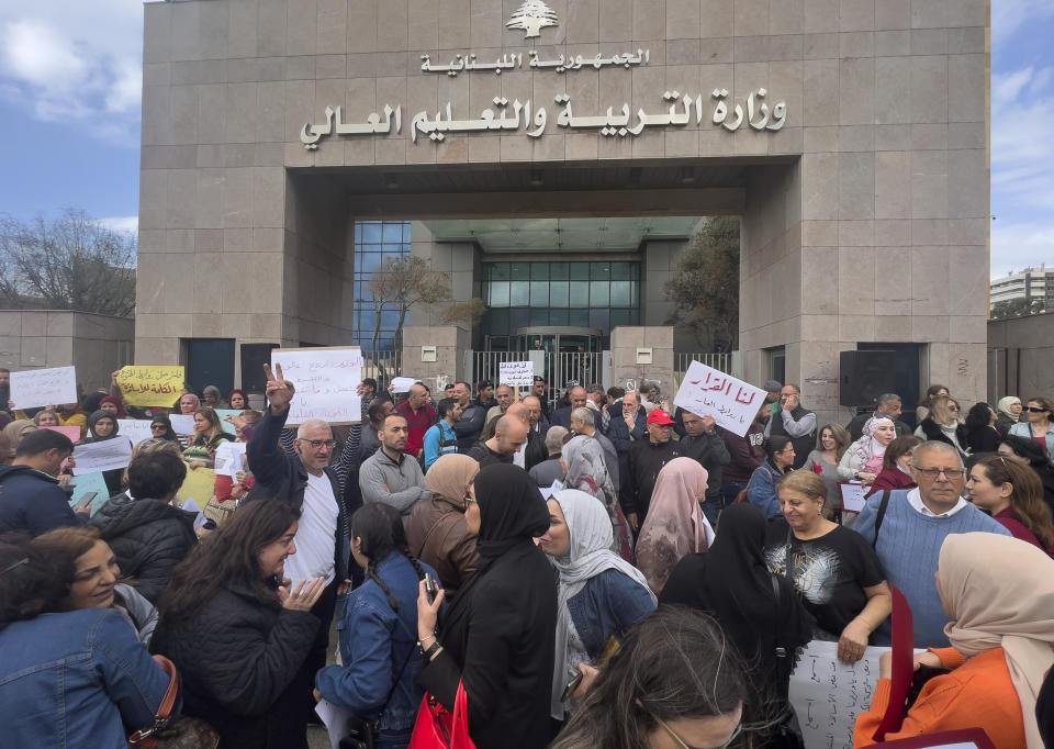 Lebanese teachers protest outside the Education Ministry, in Beirut, Lebanon, Monday, March 6, 2023. Lebanon's education system is in crisis. Public schools have been open for fewer than 50 days this school year because teachers are on strike, protesting dramatic currency devaluations that slashed their salaries to about $20 a month. (AP Photo/Hussein Malla)