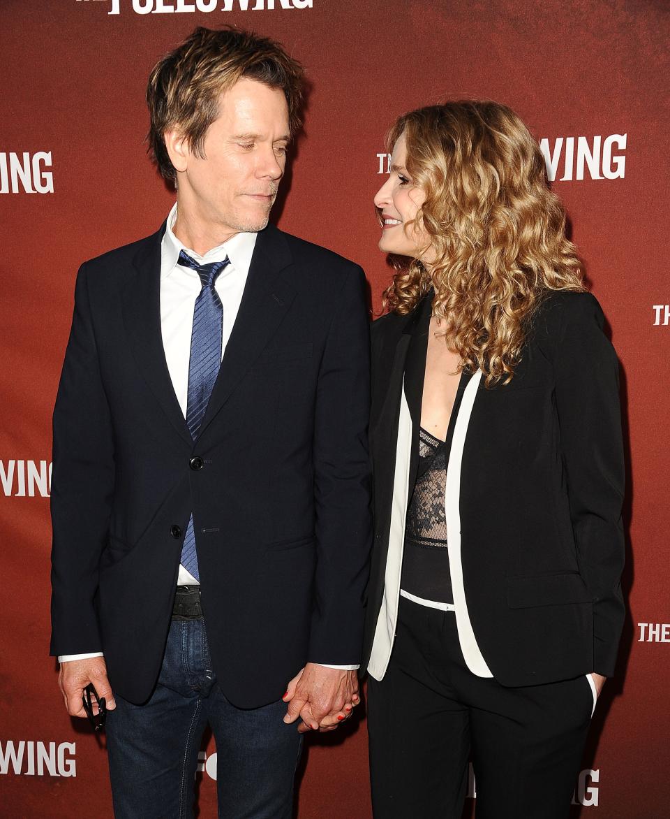 Kevin Bacon and Kyra Sedgwick looking at each other