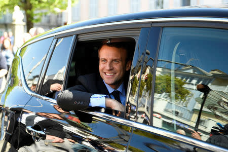 Emmanuel Macron, head of the political movement En Marche ! ( Onwards !) and candidate for the 2017 presidential election, sits in his car during a campaign visit in Bagneres de Bigorre, France, April 12, 2017. REUTERS/Eric Feferberg/Pool
