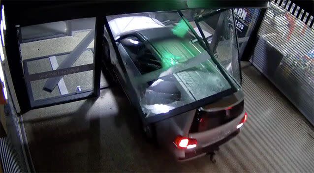 A gang of thieves used a 4WD to smash into an ACT shopping centre and steal a cash machine. Source: ACT Police