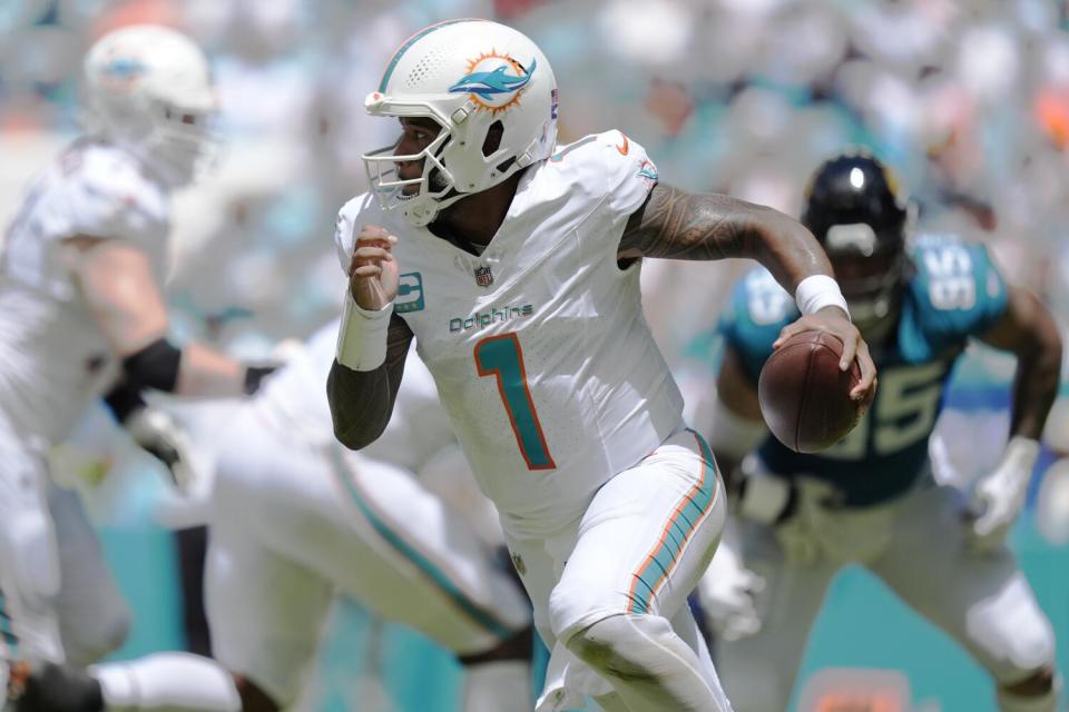 Dolphins quarterback Tua Tagovailoa (1) runs against the Jaguars in Week 1.