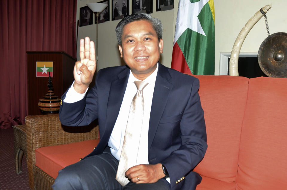 Kyaw Moe Tun, Myanmar's ambassador to the United Nations, shows a three-finger salute shared by opponents of the country's military coup during an interview in New York on June 28, 2021. The current envoy, Ambassador Kyaw Moe Tun, switched his allegiance soon after February’s takeover to the opposition’s underground National Unity Government, which styles itself as the legitimate alternative to the ruling generals. For at least a couple of months, he appears likely to keep his seat — or at least deny it to an appointee of the military government. (Kyodo News via AP)