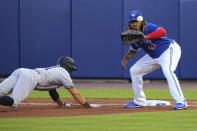 New York Yankees Brett Gardner dives back safely as Toronto Blue Jays first baseman Vladimir Guerrero Jr. awaits the throw during the fifth inning of a baseball game Wednesday, June 16, 2021, in Buffalo, N.Y. (AP Photo/Jeffrey T. Barnes)