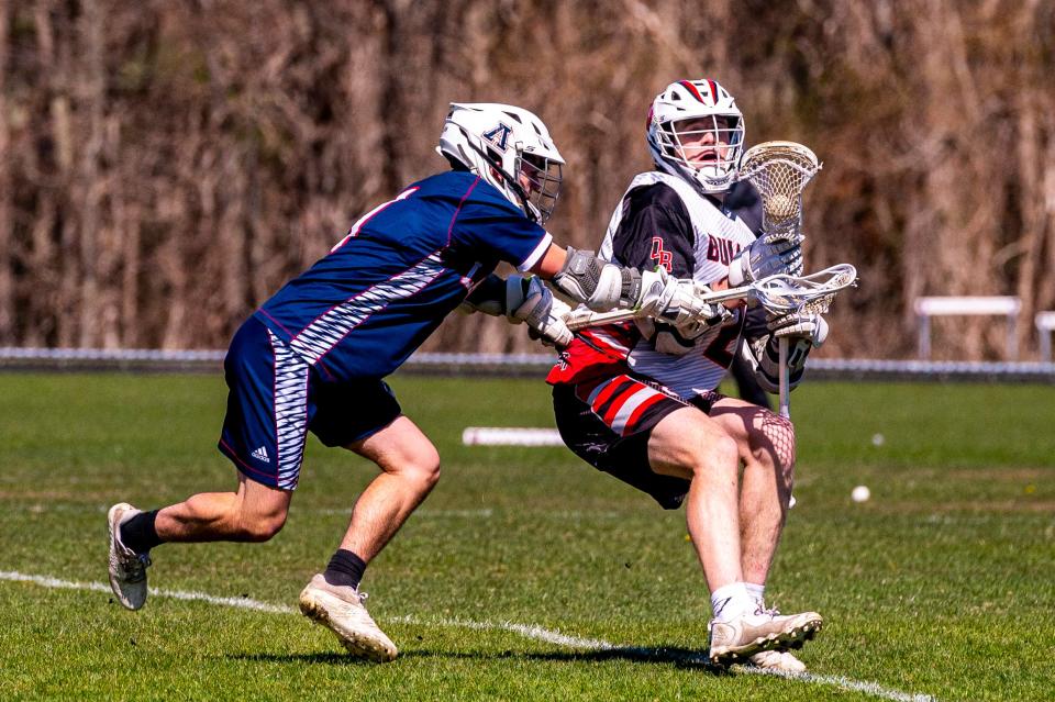 Old Rochester's Brady Lee cuts away from Apponequet's Harrison Lemieux.