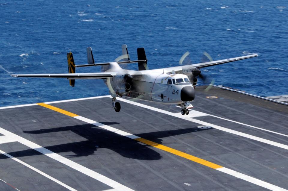 A C-2A Greyhound assigned to the Providers of Fleet Logistics Support Squadron 30 lands aboard the aircraft carrier USS <em>Nimitz</em>. (U.S. Navy photo by Mass Communication Specialist 3rd Class Peter Merrill)