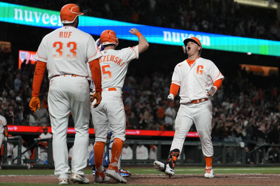 San Francisco Giants' Joc Pederson, right, celebrates with Mike Yastrzemski (5) and Darin Ruf (33) after hitting a three-run home run against the New York Mets during the eighth inning of a baseball game in San Francisco, Tuesday, May 24, 2022. (AP Photo/Tony Avelar)