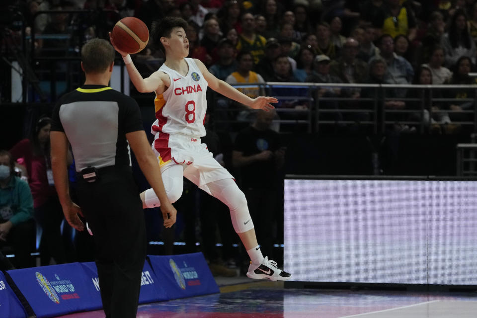 China's Jin Weina attempts to keep the ball in play during their gold medal game at the women's Basketball World Cup against the United States in Sydney, Australia, Saturday, Oct. 1, 2022. (AP Photo/Mark Baker)