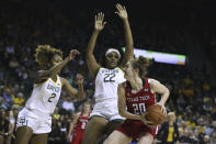 Texas Tech forward Brittany Brewer, right, is guarded by Baylor center Erin DeGrate and DiDi Richards, left, in the first half of an NCAA college basketball game, Saturday, Jan. 25, 2020, in Waco Texas. (AP Photo/Rod Aydelotte)