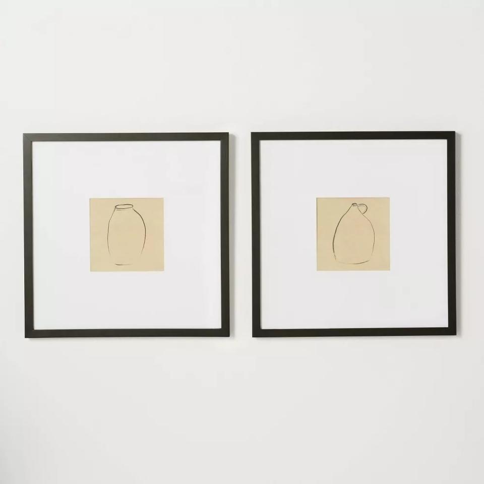 the pair of lithographs in black frames