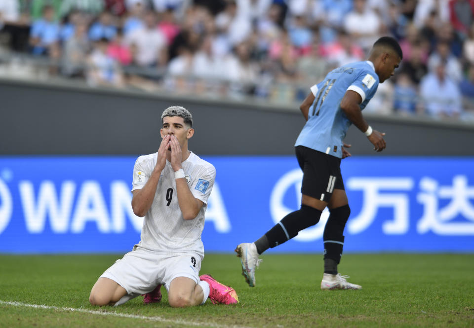 Israel's Dor Turgeman, left, reacts after missing a chance to score against Uruguay during a FIFA U-20 World Cup semifinal soccer match at the Diego Maradona stadium in La Plata, Argentina, Thursday, June 8, 2023. (AP Photo/Gustavo Garello)