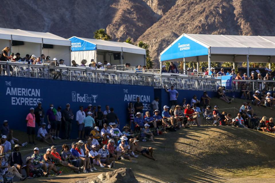 Spectators watch the 17th green of the Pete Dye Stadium course during the final round of The American Express at PGA West in La Quinta, Calif., Sunday, Jan. 23, 2022. 