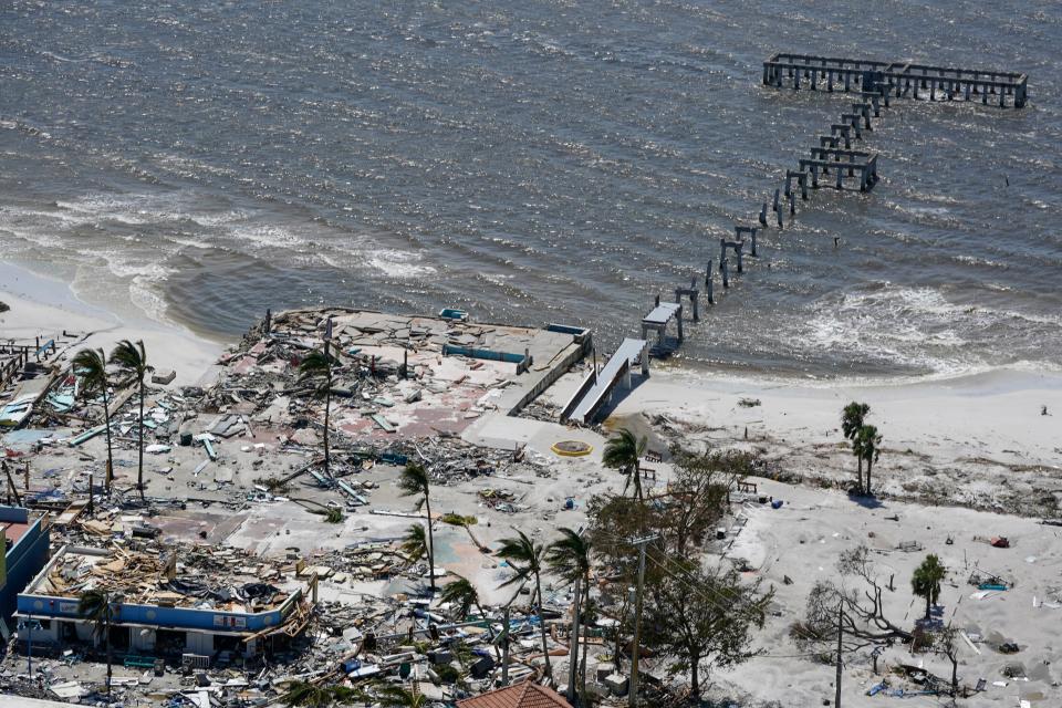 Remnants of a pier is seen in the wake of Hurricane Ian, Thursday, Sept. 29, 2022, in Fort Myers Beach, Fla. (AP Photo/Wilfredo Lee)
