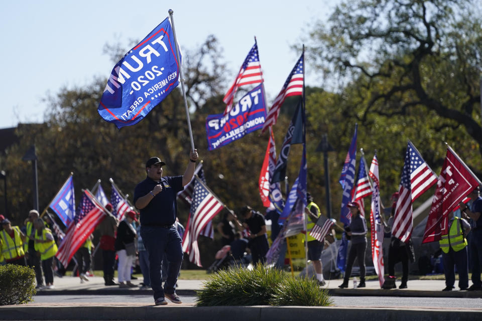 FILE - In this Jan. 6, 2021 file photo, people attend a rally in support of President Donald Trump outside Thousand Oaks City Hall in Thousand Oaks, Calif. Republicans have had wild success this year passing voting restrictions in states they control politically, from Georgia to Iowa to Texas. (AP Photo/Ashley Landis, File)