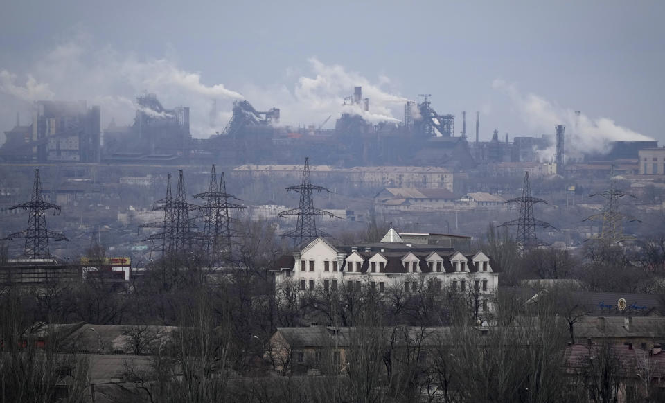 FILE - A metallurgical plant is seen on the outskirts of the city of Mariupol, Ukraine, Thursday, Feb. 24, 2022. Russia began evacuating its embassy in Kyiv, and Ukraine urged its citizens to leave Russia. Unbroken by a Russian blockade and relentless bombardment, the key port of Mariupol is still holding out, a symbol of staunch Ukrainian resistance that has thwarted the Kremlin's invasion plans. (AP Photo/Sergei Grits, File)