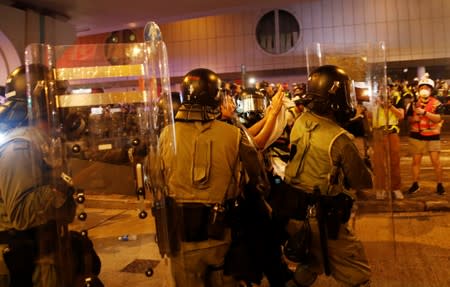 Police detain an anti-extradition demonstrator, after a march to call for democratic reforms in Hong Kong